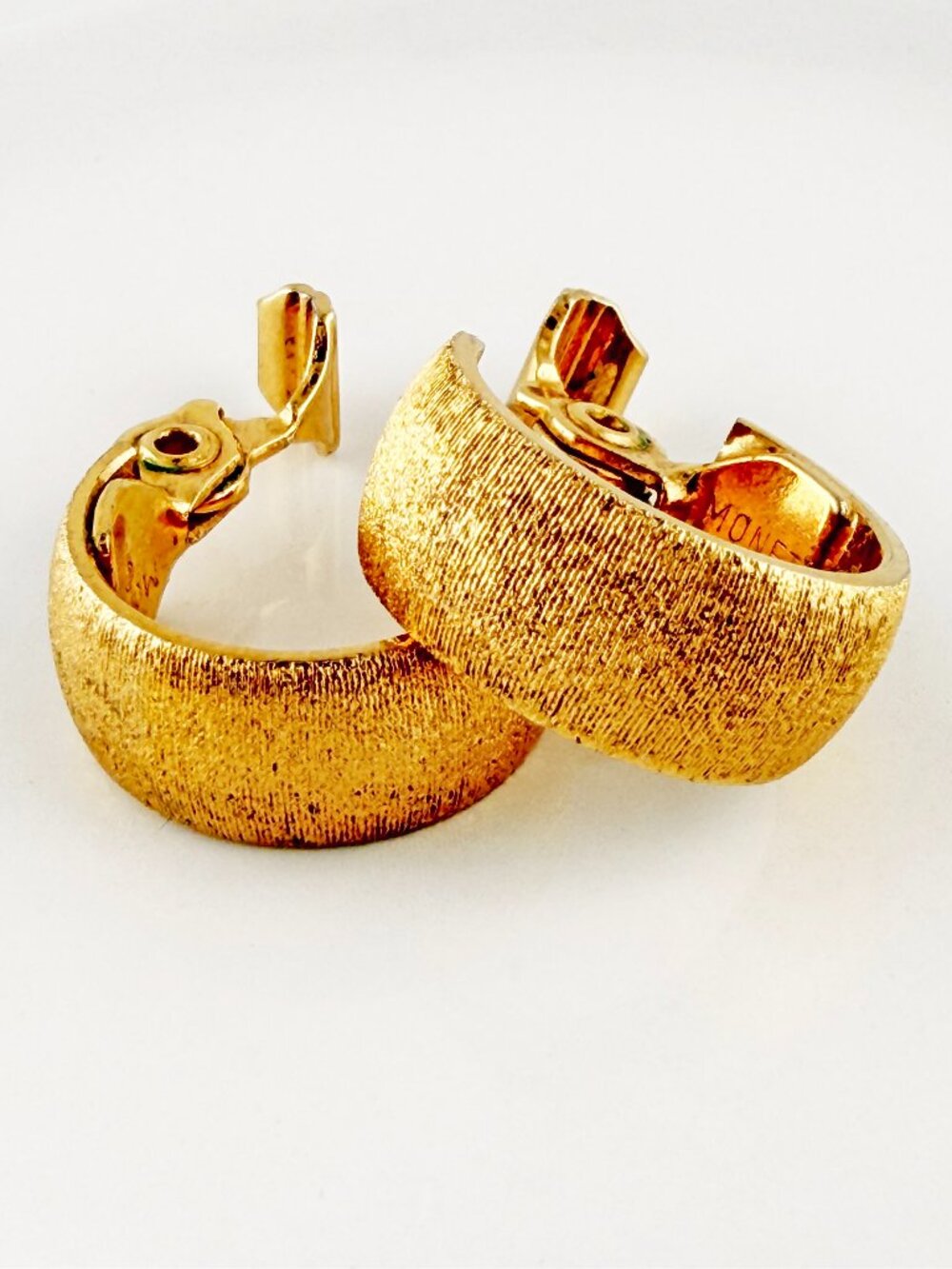 Vintage Monet Gold Tone Wide Textured Huggie Hoop Clip On Earrings